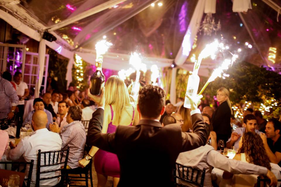 Placing lit sparklers in champagne bottles, like those seen in this file photo, is a common code violation in Providence clubs, according to Fire Department Lt. John Lima, who likens it to the pyrotechnics that ignited The Station fire.