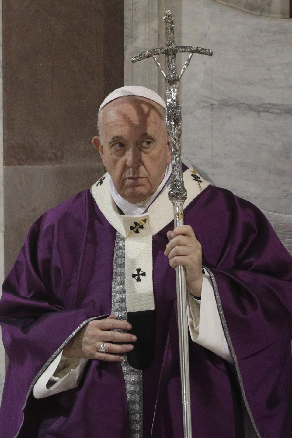 Pope Francis holds the pastoral staff as he celebrates the Ash Wednesday Mass opening Lent, the forty-day period of abstinence and deprivation for Christians before Holy Week and Easter, in the Santa Sabina Basilica, in Rome, Wednesday, Feb. 26, 2020. Pope Francis is marking Ash Wednesday with prayer and a solemn procession between two churches on one of ancient Rome's seven hills. (AP Photo/Gregorio Borgia)