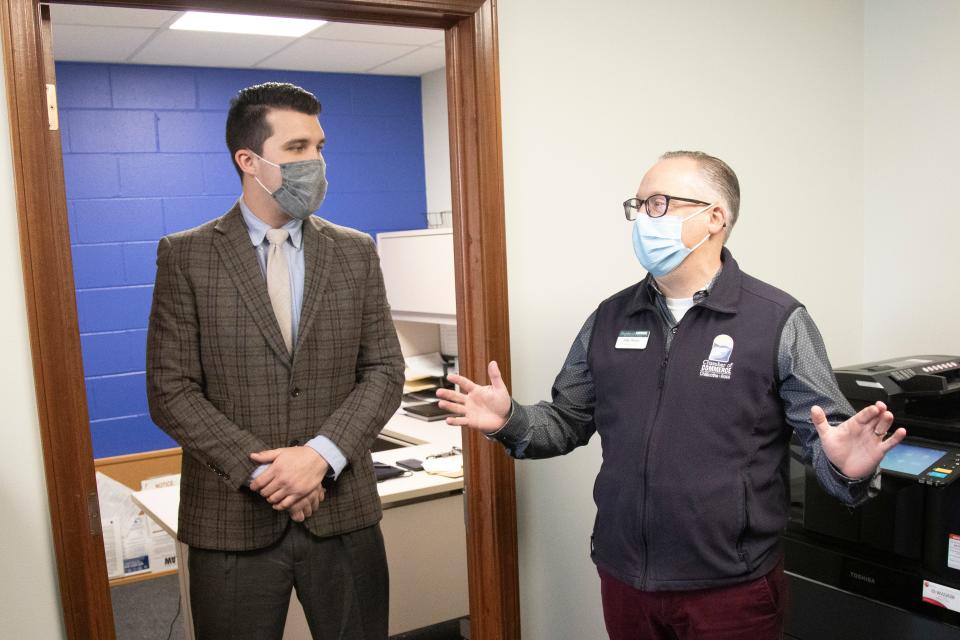 All Ways Caring Home Care branch manager Chase Thurber is welcomed by  Chamber of Commerce president and CEO Mike Throne before an official ribbon cutting at their Chillicothe facility. 