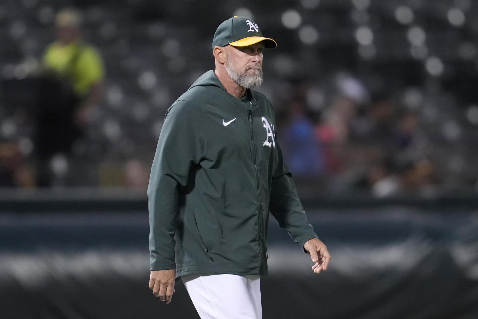 Oakland Athletics manager Mark Kotsay walks to the mound to make a pitching change during the seventh inning of his team's baseball game against the Texas Rangers in Oakland, Calif., Monday, Aug. 7, 2023. (AP Photo/Jeff Chiu)