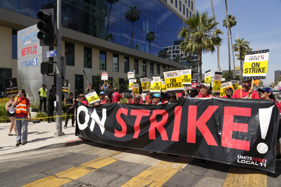 Striking Hotel workers from Unite Here Local 11 join the picketing actors of SAG-AFTRA, and writers of the WGA, outside Netflix studios on Friday, July 21, 2023, in Los Angeles. The actors strike comes more than two months after screenwriters began striking in their bid to get better pay and working conditions. (AP Photo/Chris Pizzello)