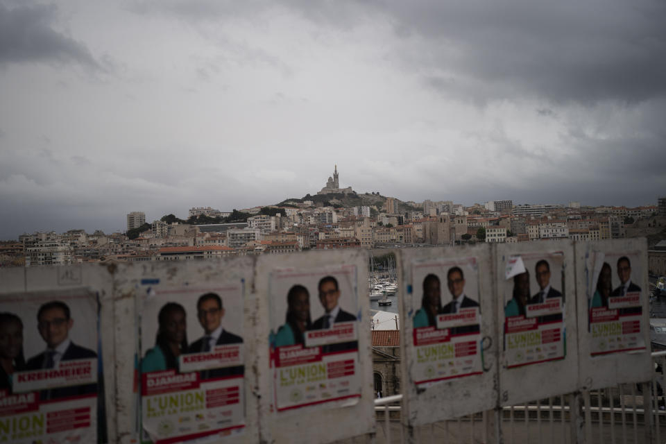 Electoral campaign boards are pictured during regional elections in Marseille, southern France, Sunday, June 20, 2021. Marine Le Pen's far-right party is riding high on her tough-on-security, stop-immigration message as French voters started choosing regional leaders Sunday in an election that many see as a dress rehearsal for next year's presidential vote. (AP Photo/Daniel Cole)