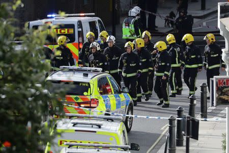 Members of the emergency services work near Parsons Green tube station in London, Britain September 15, 2017. REUTERS/Kevin Coombs