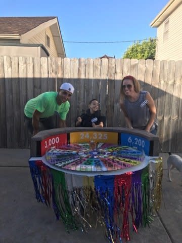 Anthony Alfano and his parents with his "Wheel Of Fortune" costume. (Photo: Deanna Alfano)