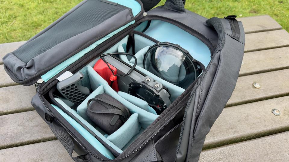 Interior compartments of a Shimoda Urban Explore 25 on a wooden table