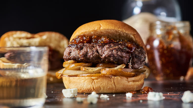 burger with pears on table