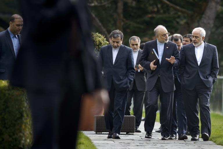 Iranian Deputy Foreign Minister Abbas Araghchi (L), Head of Iranian Atomic Energy Organization Ali Akbar Salehi (C) and Iranian Foreign Minister Javad Zarif walk together during negotiations on March 29, 2015 in Lausanne, Switzerland