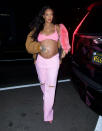 While pregnant with her first child, the "Man Down" artist showed off her belly in a pink Bottega Veneta top, a R13 jacket and Vetements jeans.