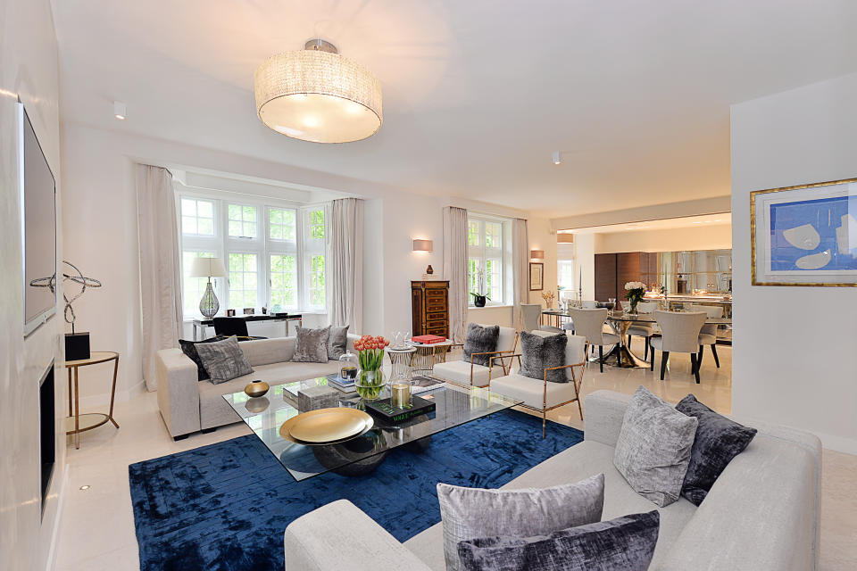 <p>Staff will share a 2,400 sq ft four bedroom flat, including this lavish living room. </p>