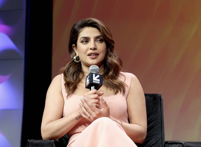 Priyanka talking into a mic