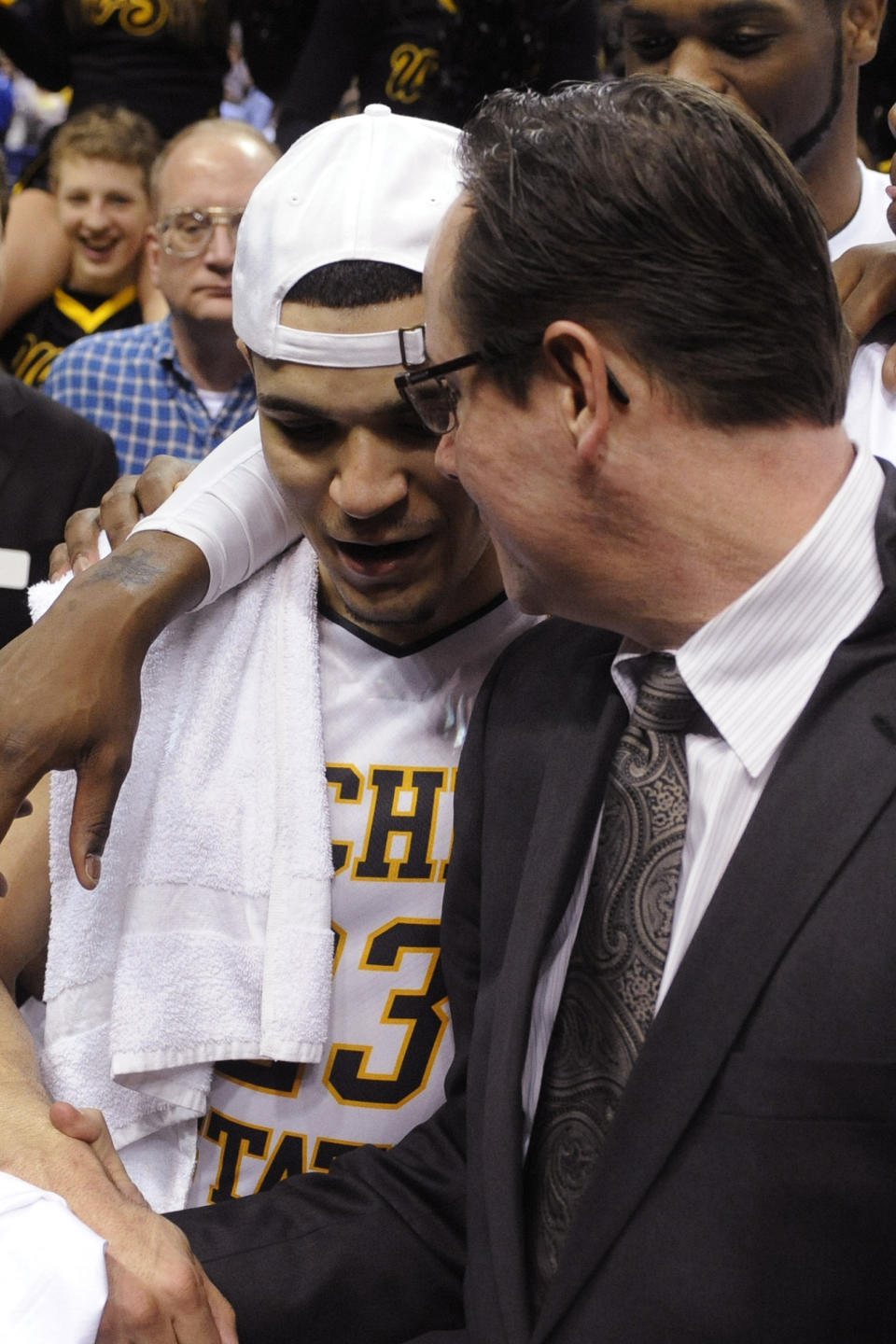 Wichita State coach Gregg Marshall, right, celebrates with Fred VanVleet, left, after their victory over Indiana State in an NCAA college basketball game for the championship of the Missouri Valley Conference, Sunday, March 9, 2014, in St. Louis. (AP Photo/Bill Boyce)