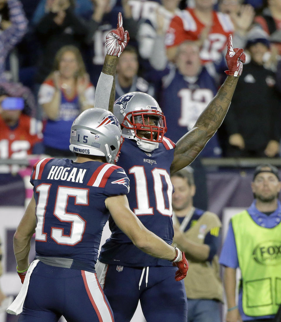 FILE - In this Oct. 4, 2018, file photo, New England Patriots wide receiver Josh Gordon (10) celebrates his touchdown catch with Chris Hogan (15) during the second half of an NFL football game against the Indianapolis Colts, in Foxborough, Mass. Patriots receiver Josh Gordon says he is stepping away from football in order to focus on his mental health. In a statement posted on Twitter on Thursday morning, Dec. 20, 2018, Gordon said his decision was spurred by him feeling recently that he could have a better grasp on things mentally. He thanked the Patriots for their support and vowed to work his way back. (AP Photo/Steven Senne, File)