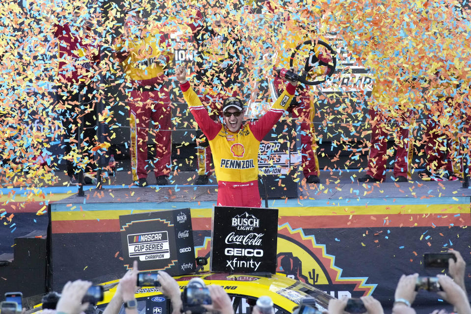 Joey Logano celebrates after winning a NASCAR Cup Series auto race and championship Sunday, Nov. 6, 2022, in Avondale, Ariz. (AP Photo/Rick Scuteri)