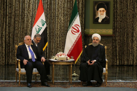 Iranian President Hassan Rouhani meets with Iraqi Prime Minister Haider Al-Abadi, in Tehran, Iran, October 26, 2017. President.ir/Handout via REUTERS ATTENTION EDITORS - THIS PICTURE WAS PROVIDED BY A THIRD PARTY. NO RESALES. NO ARCHIVE.