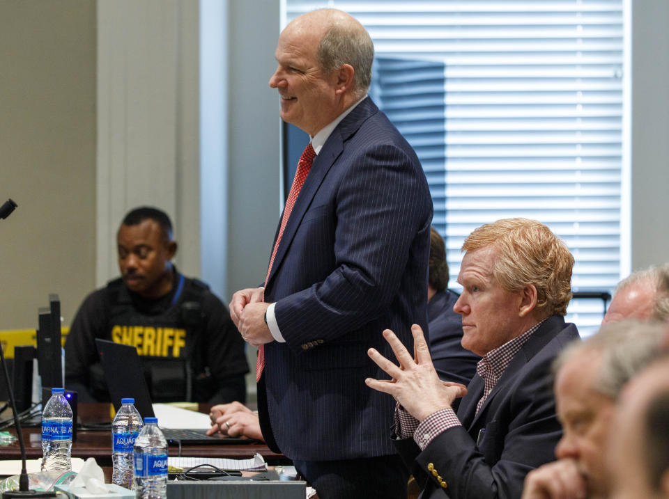 Defense attorney Jim Griffin addresses the court about a Twitter post prior to the start of court during the trial of Alex Murdaugh, sitting at right, at the Colleton County Courthouse in Walterboro, S.C., on Tuesday, Feb. 21, 2023. The 54-year-old attorney is standing trial on two counts of murder in the shootings of his wife and son at their Colleton County, S.C., home and hunting lodge on June 7, 2021. (Grace Beahm Alford/The Post And Courier via AP, Pool)