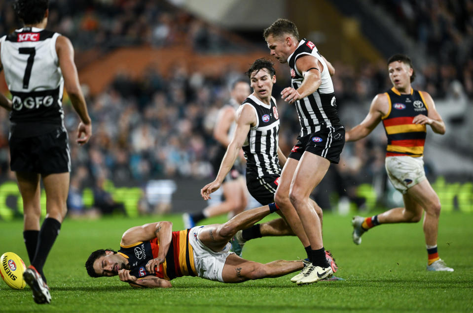 ADELAIDE, AUSTRALIA - AUGUST 17:   Izak Rankine of the Crows is knocked out by  a late hit from  Dan Houston of the Power during the round 23 AFL match between Port Adelaide Power and Adelaide Crows at Adelaide Oval, on August 17, 2024, in Adelaide, Australia. (Photo by Mark Brake/Getty Images)