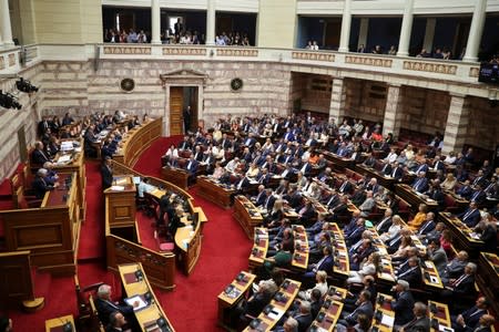Greek PM Mitsotakis presents his government's main policies during a parliamentary session in Athens