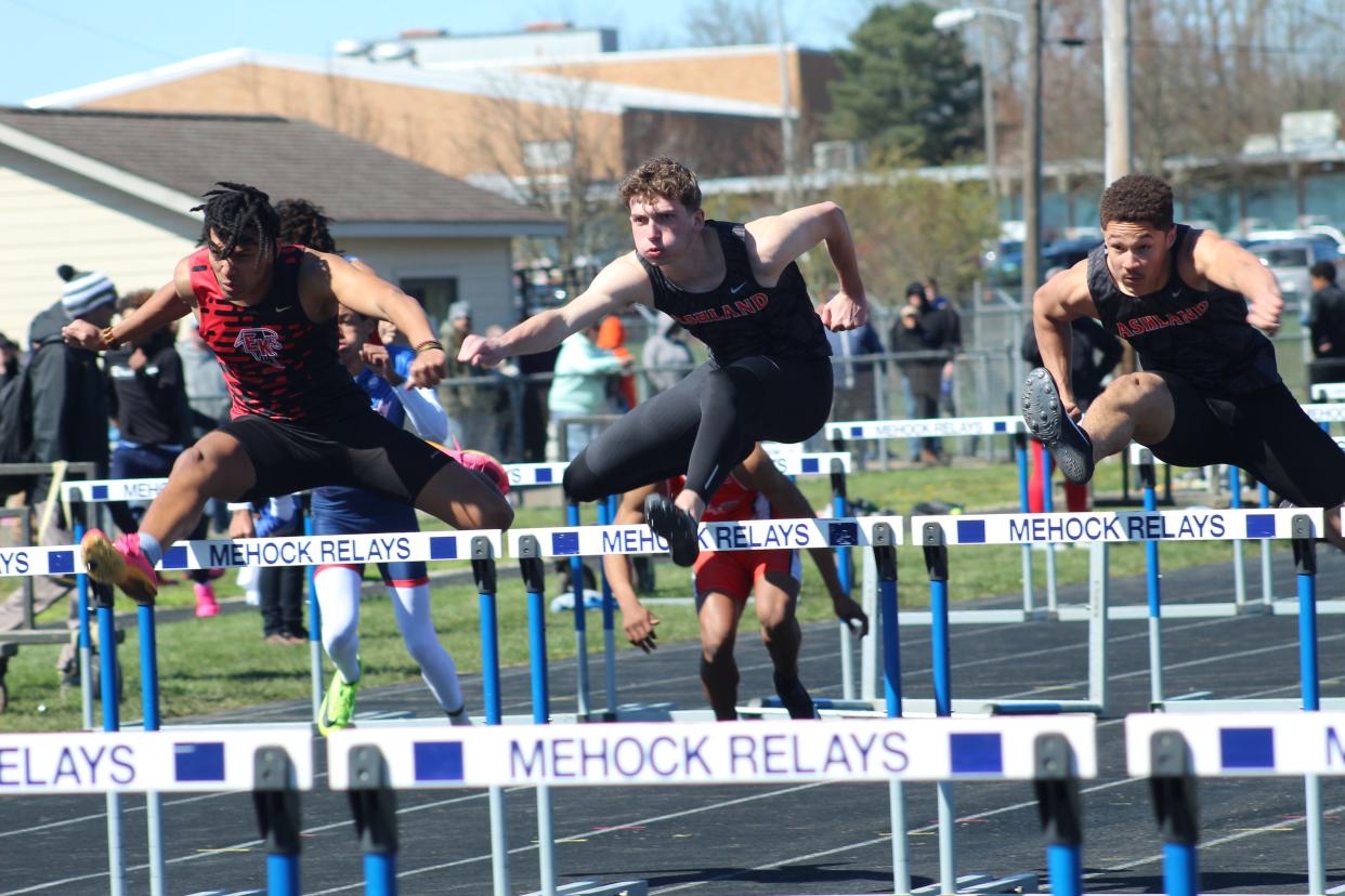 Ashland hurdlers Braydon Martin (middle) and Jayden Goings (right) competed in the 110 hurdles final at the 91st Mehock Relays on Saturday.