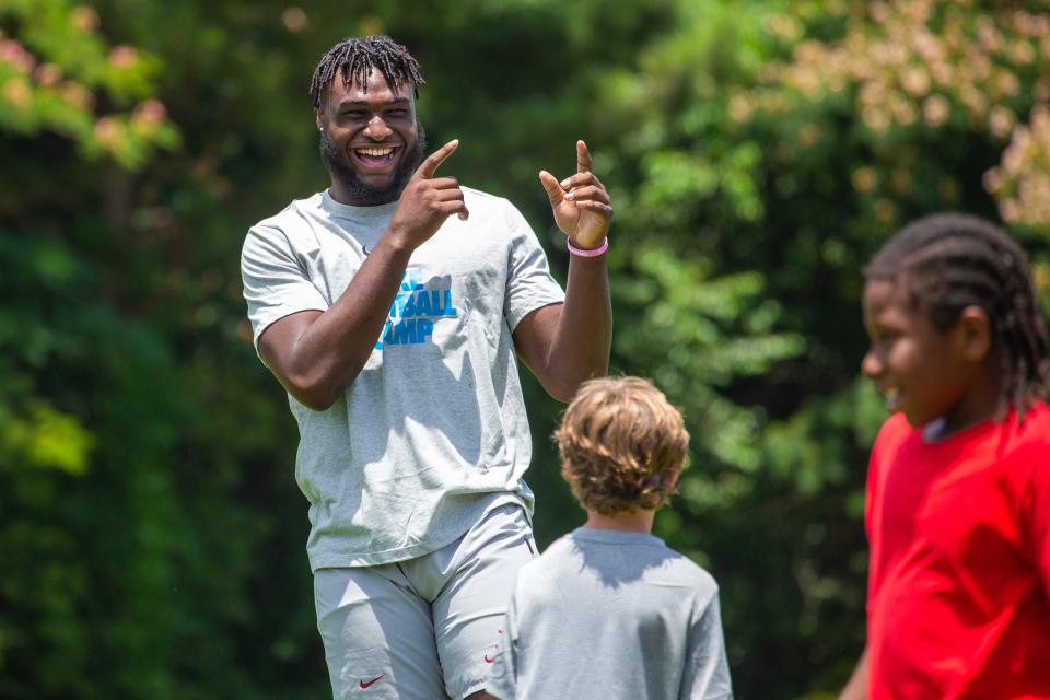 Alabama outside linebacker Will Anderson Jr. coaches young football players at the Nike Football Skills Camp at Hillcrest High School, Wednesday June 15, 2022. [Photo/Will McLelland] 