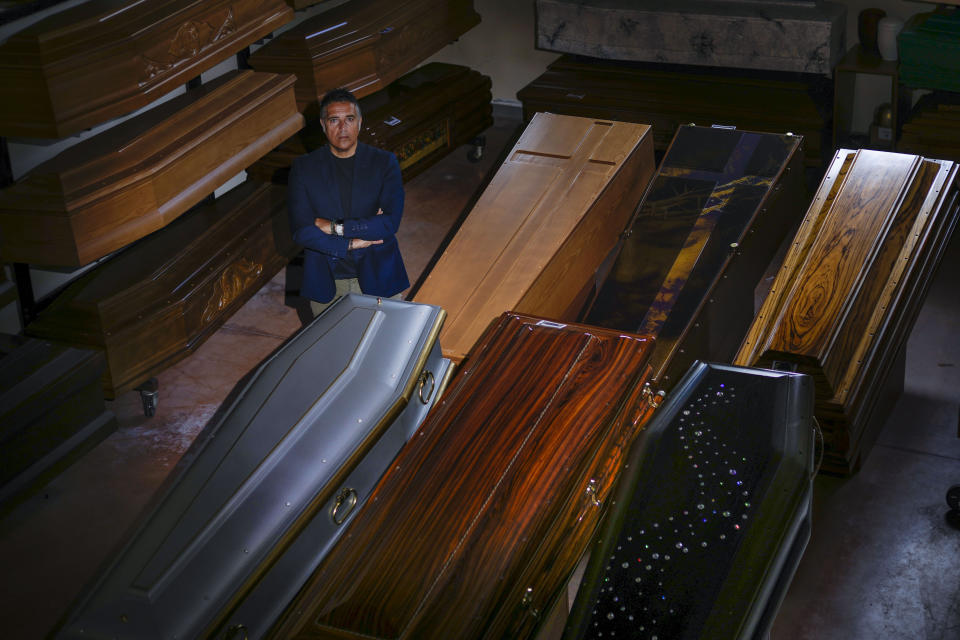 Antonio Ruggieri, a fifth-generation funeral home director, poses in his funeral home in Voltarrosto, near Teramo in central Italy, Monday, June 5, 2023. (AP Photo/Domenico Stinellis)