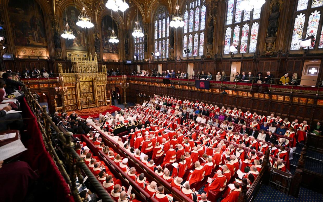 Members of the House of Lords await the start of the State Opening of Parliament in the House of Lords