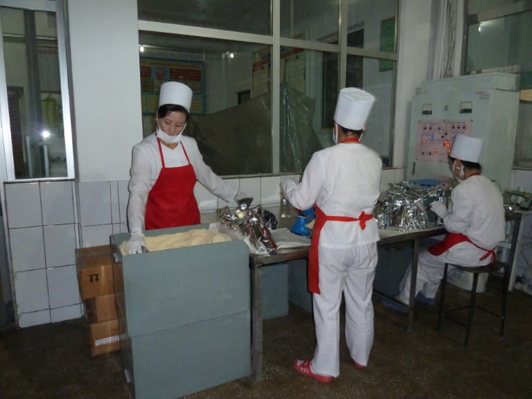 Staff at a World Food Programme factory in Pyongyang, North Korea, prepare milk products for babies and children for country-wide distribution