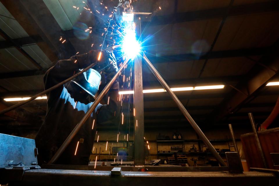 Jay Medeiros welds a boat rack at the Brownell Boat Stands manufacturing plant in the Mattapoisett industrial park.