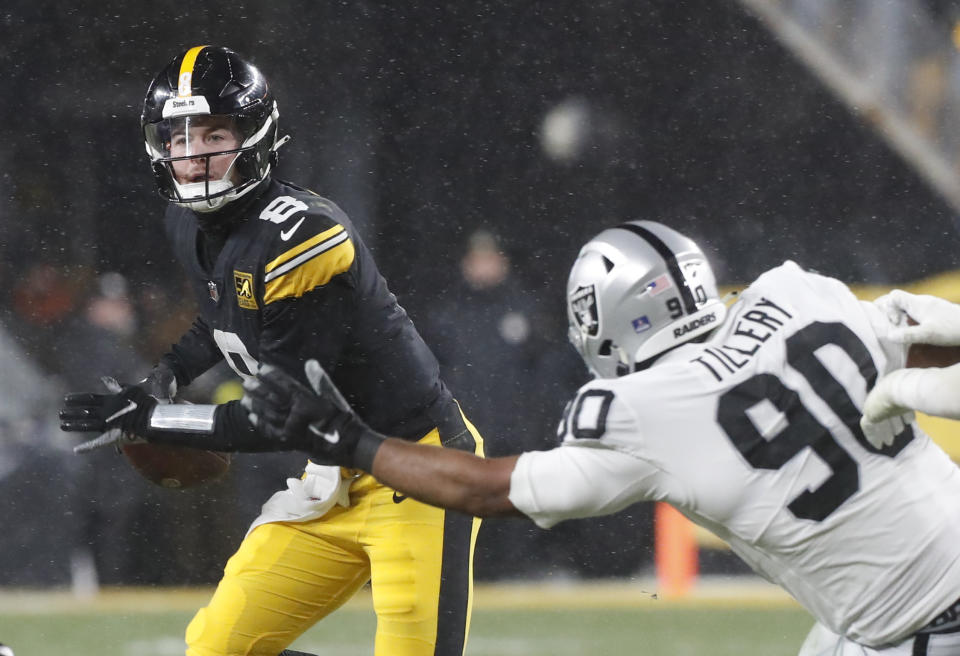 Dec 24, 2022; Pittsburgh, Pennsylvania, USA; Pittsburgh Steelers quarterback Kenny Pickett (8) scrambles against pressure from Las Vegas Raiders defensive tackle <a class="link " href="https://sports.yahoo.com/nfl/players/31860" data-i13n="sec:content-canvas;subsec:anchor_text;elm:context_link" data-ylk="slk:Jerry Tillery;sec:content-canvas;subsec:anchor_text;elm:context_link;itc:0">Jerry Tillery</a> (90) during the second quarter at Acrisure Stadium. Mandatory Credit: Charles LeClaire-USA TODAY Sports