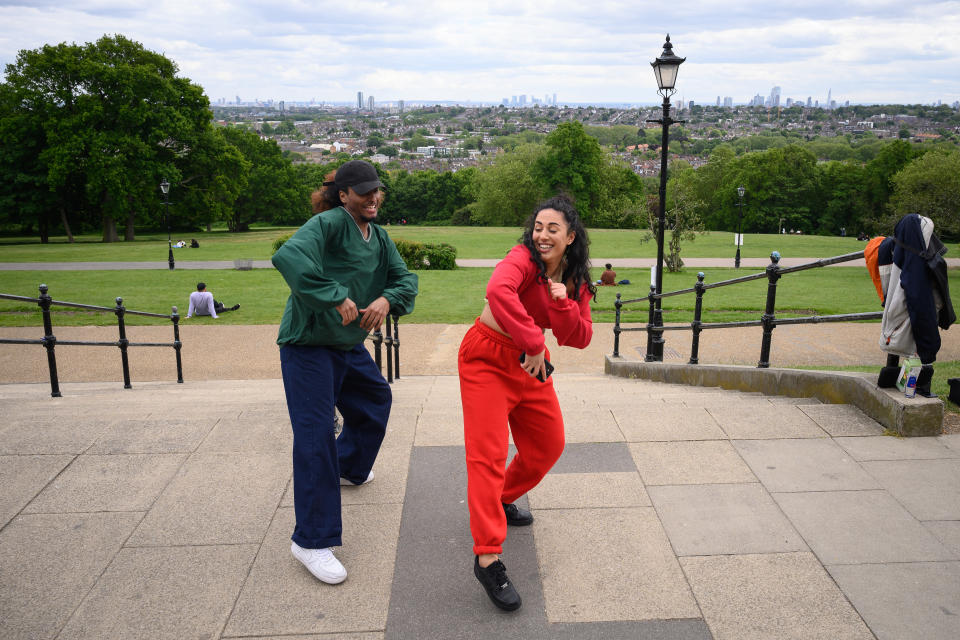 LONDON, UNITED KINGDOM - MAY 13: Two dancers take the opportunity to practise in the fresh air of Alexandra Park, as some aspects of the lockdown are eased, on May 13, 2020 in London, England. The prime minister announced the general contours of a phased exit from the current lockdown, adopted nearly two months ago in an effort curb the spread of Covid-19. (Photo by Leon Neal/Getty Images)