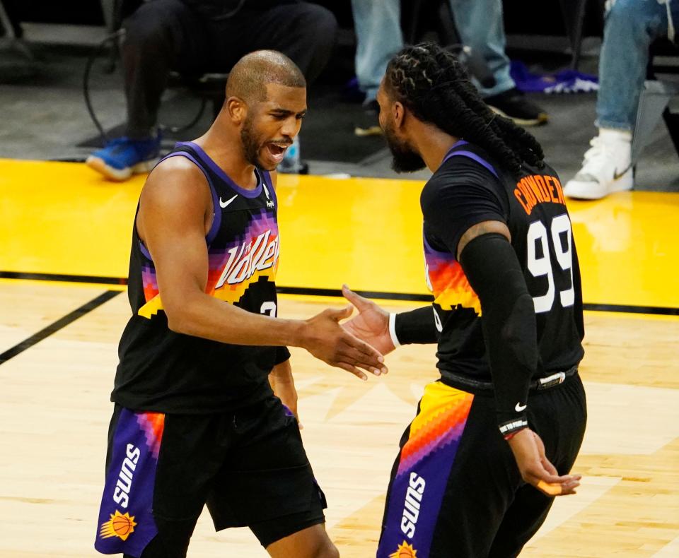 Phoenix Suns guard Chris Paul (3) celebrates with forward Jae Crowder (99) against the Denver Nuggets during game two in the second round of the 2021 NBA Playoffs at Footprint Center in Phoenix on June 9, 2021.