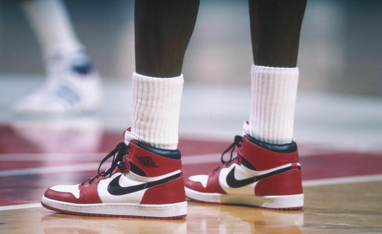 Jordan wears his iconic 'Air Jordan' Nike sneakers during a game in 1985. <a href="https://www.gettyimages.com/detail/news-photo/detail-of-the-air-jordan-nike-shoes-worn-by-chicago-bulls-news-photo/53033254?adppopup=true" rel="nofollow noopener" target="_blank" data-ylk="slk:Focus on Sport/Getty Images;elm:context_link;itc:0;sec:content-canvas" class="link ">Focus on Sport/Getty Images</a>