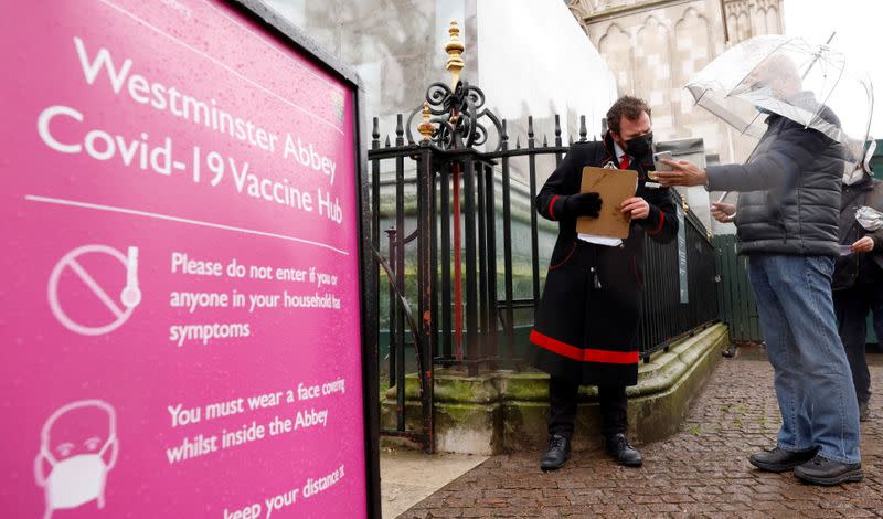 Patients are greeted by Abbey staff outside a vaccination centre at Westminster Abbey, amid the outbreak of coronavirus disease (COVID-19), in London