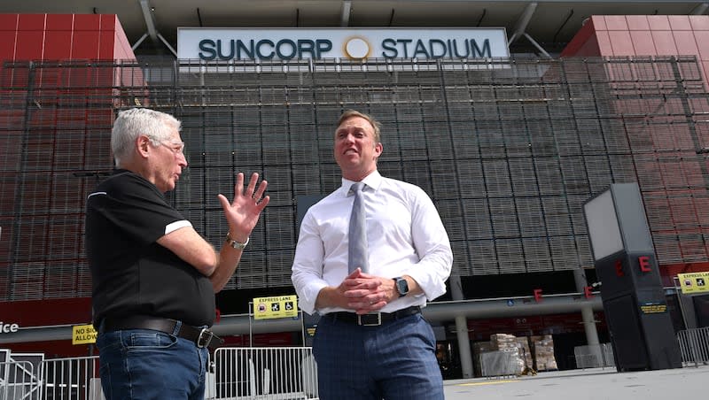 Suncorp Stadium general manager Alan Graham, left, and Queensland state Premier Steven Miles stand in front of the stadium in Brisbane, Australia, on March 18, 2024. Brisbane Olympics organizers have scrapped plans to demolish and rebuild an iconic cricket ground as the centerpiece of the 2032 Games while also rejecting a review panel's recommendation for a new stadium in city parklands.