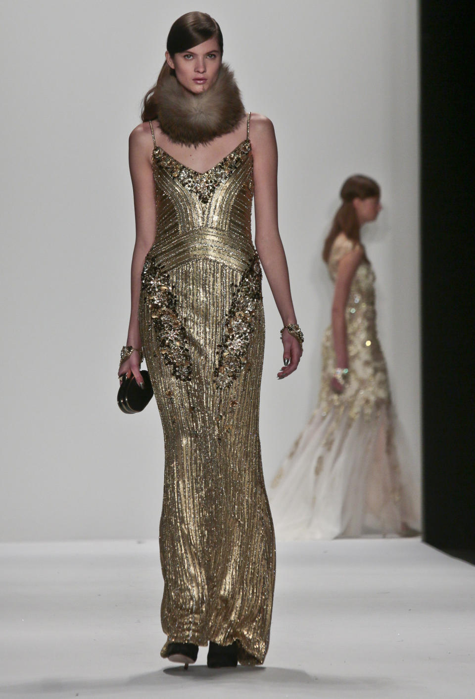 Fashion from the Badgley Mischka Fall 2014 collection is modeled during New York Fashion Week on Tuesday, Feb. 11, 2014. (AP Photo/Bebeto Matthews)