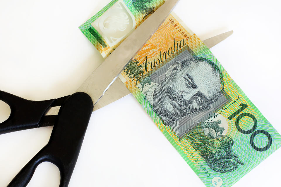 Australian dollars cut with scissors.