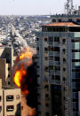 A view of a 11-story building housing AP office and other media in Gaza City is seen as Israeli warplanes demolished it, Saturday, May 15, 2021. The airstrike Saturday came roughly an hour after the Israeli military ordered people to evacuate the building. There was no immediate explanation for why the building was targeted. The building housed The Associated Press, Al-Jazeera and a number of offices and apartments. (AP Photo/Hatem Moussa)