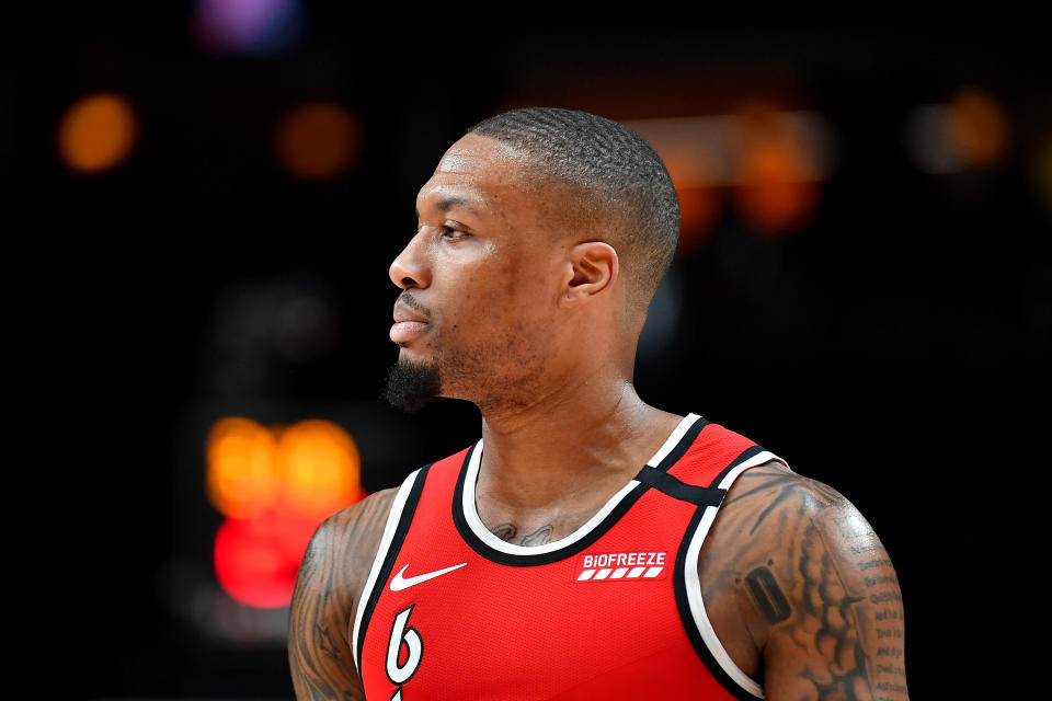 Damian Lillard looks on during a game in March.