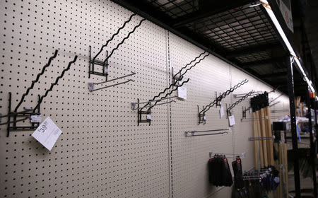 Empty displays where sold out snow shovels were once hung are seen at Strosniders Hardware store in Silver Spring, Maryland January 21, 2016. REUTERS/Gary Cameron