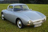 <p>The Monza was an aerodynamic, plastic-bodied coupe based on the Sonderklasse running gear and chassis supplied directly (at least for a while) by DKW and assembled at different times by three German companies. In 1956, at the Italian circuit of the same name, a Monza set new world speed records for cars with engines up to 1100cc over 4000 miles, 5000 miles, 10,000 kilometres, 48 hours and 72 hours, all at around 140km/h (87mph). Until the Monza came along, all these records stood at 123km/h (76mph).</p><p>Production came to an end when DKW introduced the Auto Union 1000 Sp and decided that it made no sense to supply parts to the manufacturer of a rival car.</p>