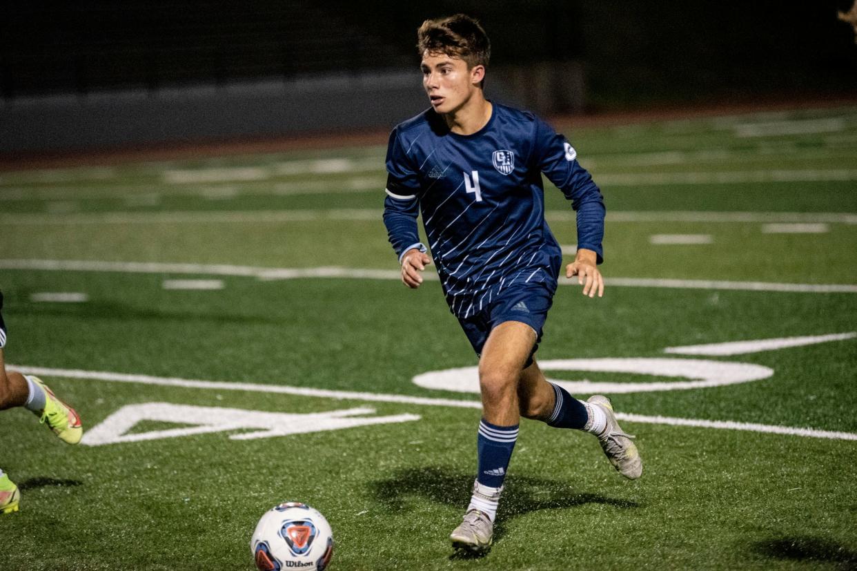 Gull Lake senior AJ Boucher (4) drives the ball on Thursday, Oct. 28, 2021 at Otsego High School. Gull Lake defeated St. Joseph 2-0.