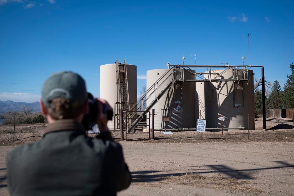 Andrew Klooster, the Colorado field advocate for Earthworks, uses a thermal camera to inspect an oil and produced water storage site operated by Prospect Energy LLC north of Fort Collins on Nov. 11.