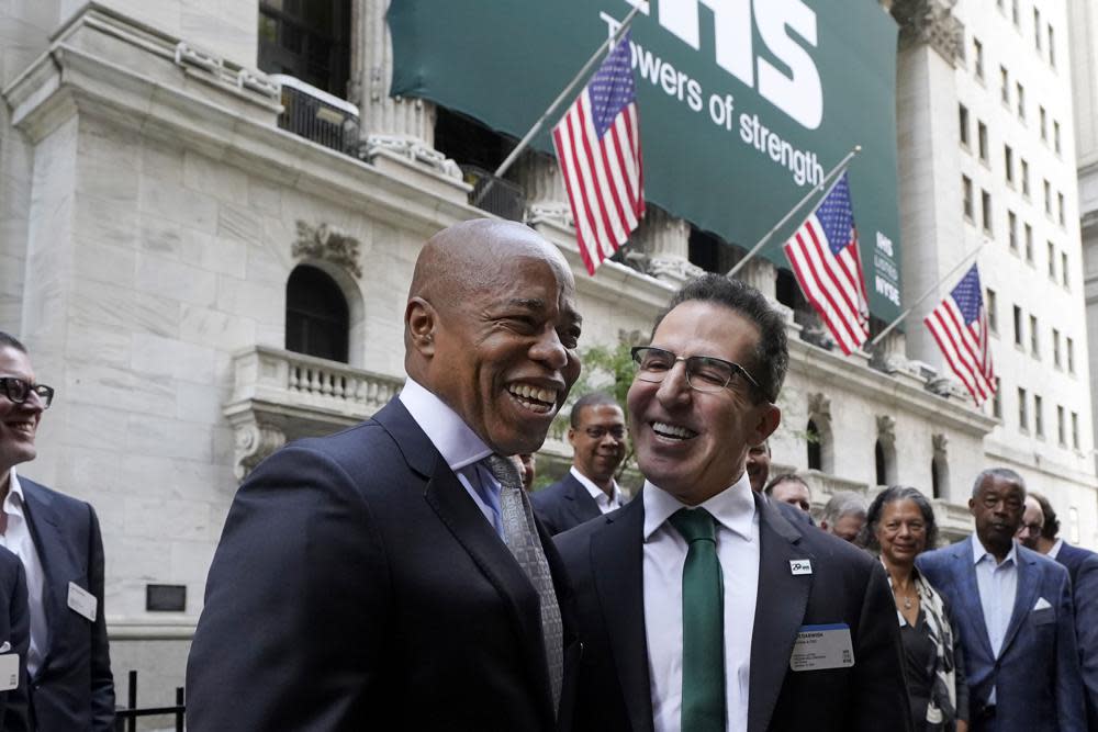 Democrat candidate for New York Mayor Eric Adams, left, poses for photos with IHS Towers Chairman & CEO Sam Darwish outside the New York Stock Exchange, before the company’s IPO, Thursday, Oct. 14, 2021. (AP Photo/Richard Drew)