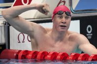 Tom Dean of Britain celebrates after winning the final of the men's 200-meter freestyle at the 2020 Summer Olympics, Tuesday, July 27, 2021, in Tokyo, Japan. (AP Photo/Matthias Schrader)