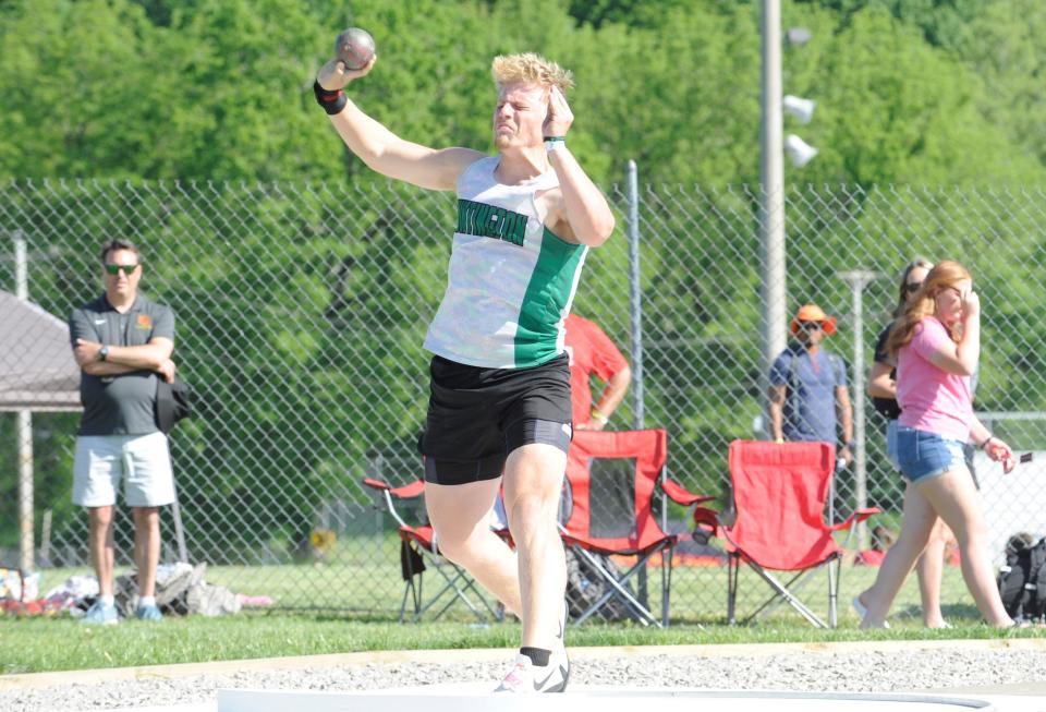 Huntington's Ryan Marion during the boys shot put in the Division III regional track and field meet at Heath High School on May 26, 2023.
