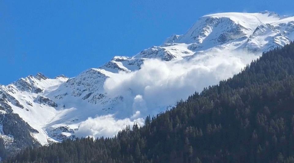 In this photo provided by Contamines Montjoie, an avalanche rolling down the Armancette glacier in Contamines-Montjoie, France, in the Haute-Savoie region, some 30 kilometers (almost 20 miles) southwest of Chamonix, Sunday April 9, 2023. The death toll from Sunday's avalanche in the French Alps rose to six, including two mountain guides, local authorities said Monday.