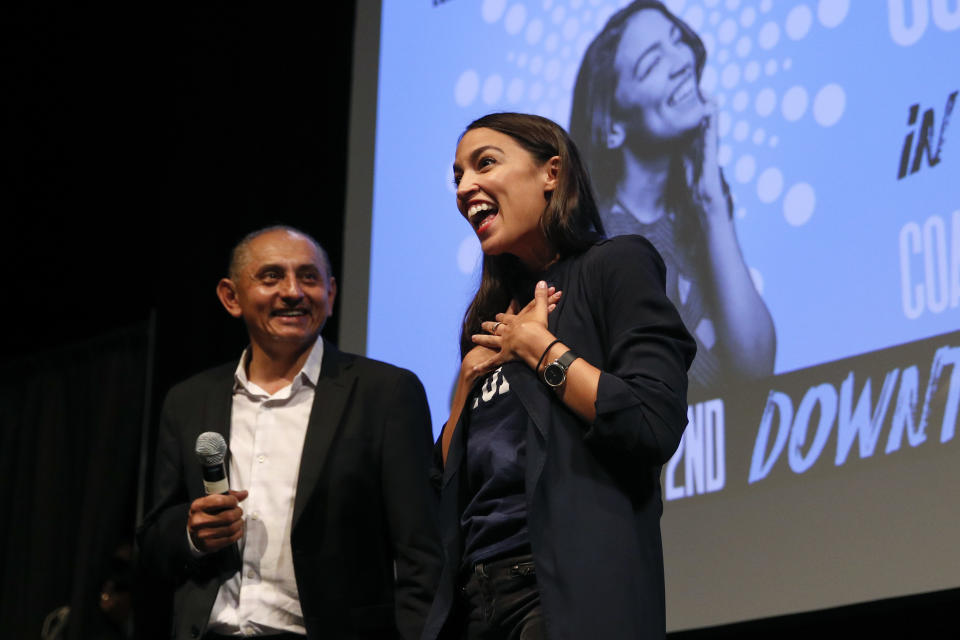 New York congressional candidate Alexandria Ocasio-Cortez acknowledges her supporters as she is introduced at a fundraiser Thursday, Aug. 2, 2018, in Los Angeles. The 28-year-old startled the party when she defeated 10-term U.S. Rep. Joe Crowley in a New York City Democratic primary. (AP Photo/Jae C. Hong)