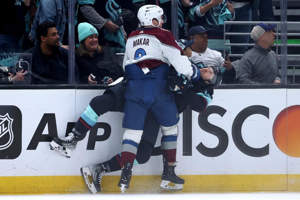 Colorado Avalanche defenseman Cale Makar receives an interference penalty for his check on Seattle Kraken forward Jared McCann.