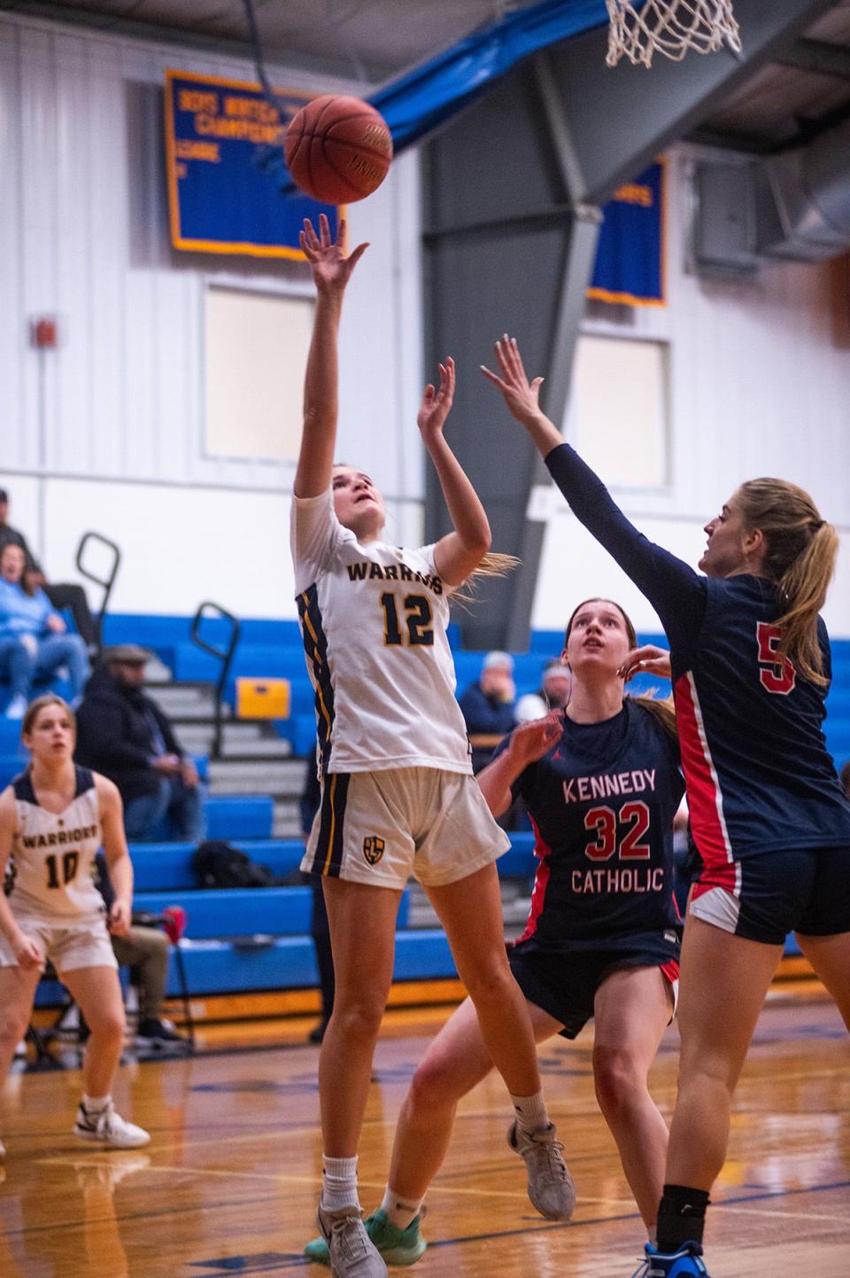 Lourdes' Sofi Pelish, center, shoots during the girls basketball game at Our Lady of Lourdes High School in Poughkeepsie, NY on Saturday, December 9, 2023. Loudes defeated Kennedy 65-38. KELLY MARSH/FOR THE POUGHKEEPSIE JOURNAL