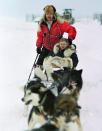 In this Jan. 19, 2000, file photo, U.S. Census Bureau director Kenneth Prewitt, seated, gets a dog sled ride into town by Harold Johnson after arriving for the first count in the Eskimo village of Unalakleet, Alaska. The 2020 Census kicks off Tuesday, Jan. 21, 2020, in remote Alaska. The first count in the Bering Sea community of Toksook Bay. The Census always starts in remote parts of the nation's largest state out of tradition and necessity. (AP Photo/Al Grillo, File)