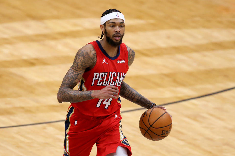 Jan 30, 2021; New Orleans, Louisiana, USA; New Orleans Pelicans forward Brandon Ingram (14) dribbles up court in the third quarter against the Houston Rockets at the Smoothie King Center.